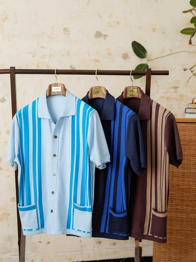 Short-sleeved knitted polo cardigan with lapel collar and blue striped pattern laid flat