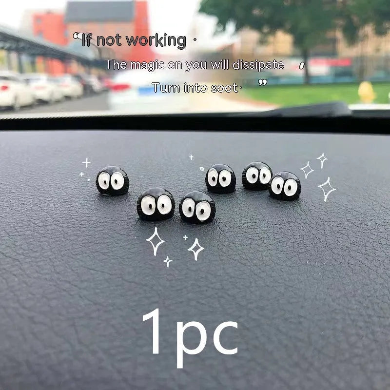 Small black cartoon-style briquette car decoration made of resin with adhesive tape.