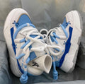 Women's grey chunky platform sneakers with thick rubber sole and lace-up front