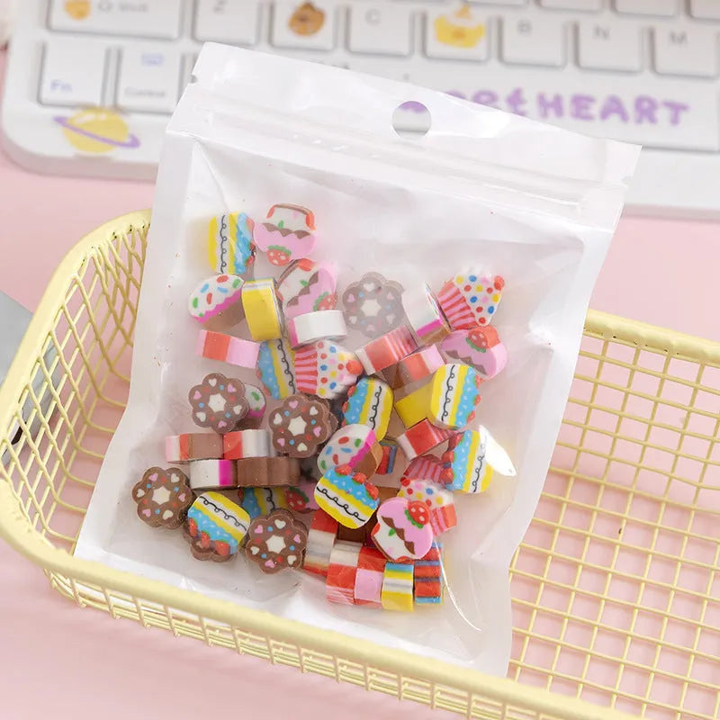 50 small colourful cartoon novelty erasers including fruit and animal shapes in a pearlescent film bag.