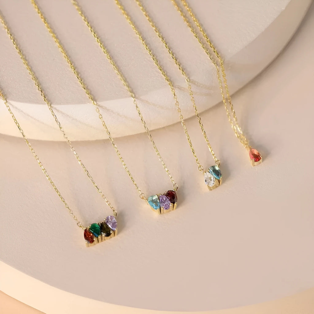 Zircon stone pendant on a delicate titanium steel clavicle chain, shown in an electroplated silver finish.
