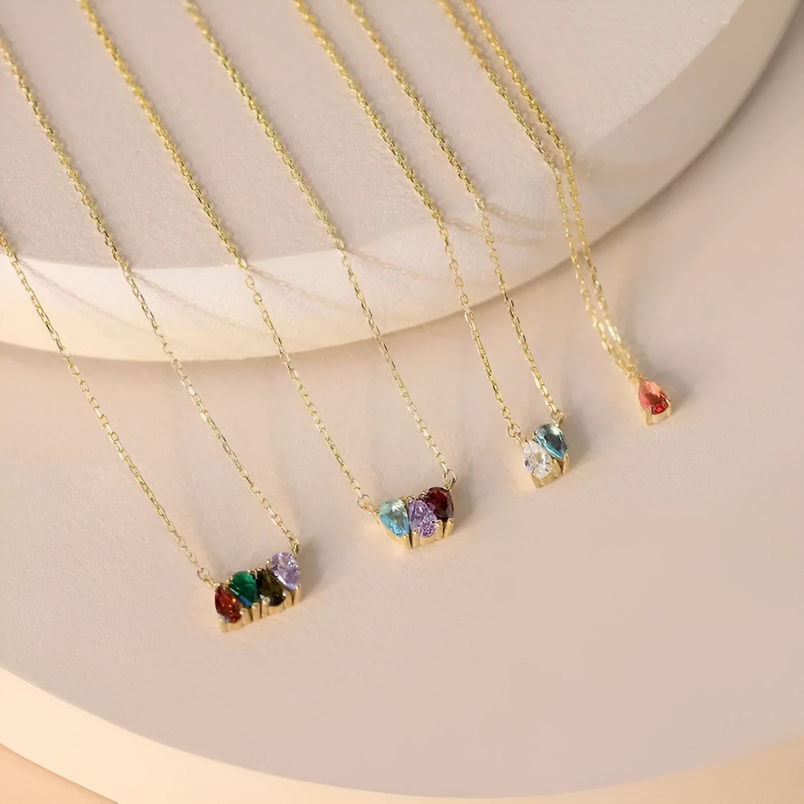 Zircon stone pendant on a delicate titanium steel clavicle chain, shown in an electroplated silver finish.