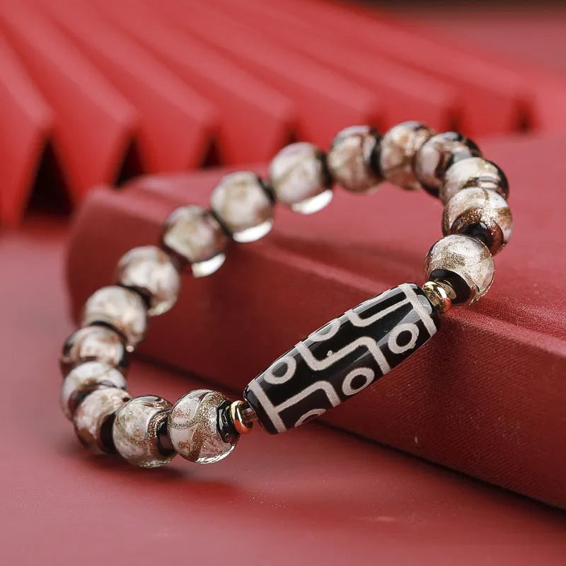 Snake year lucky bracelet with multicoloured glazed beads in Chinese auspicious patterns.