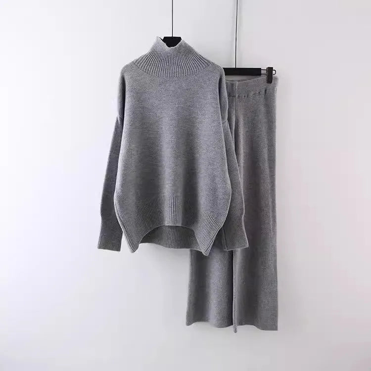Women's casual two-piece set with long sleeve sweater and wide leg trousers in a solid colour.