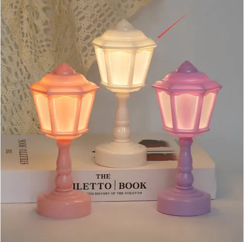 Retro pagoda-shaped small LED night lamp in light purple with geometric stereo design
