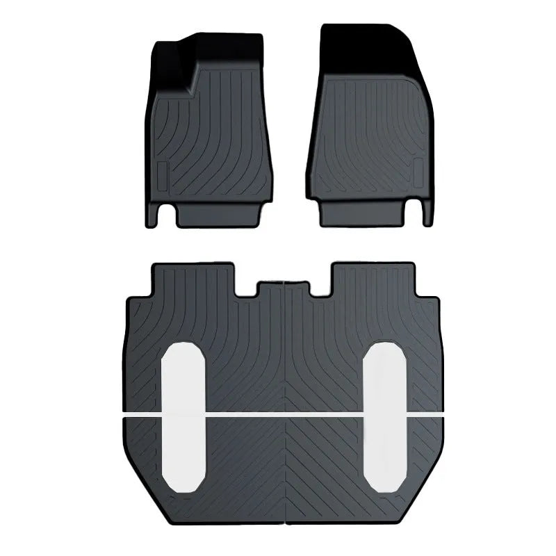 Set of black rubber floor mats for a Tesla car interior