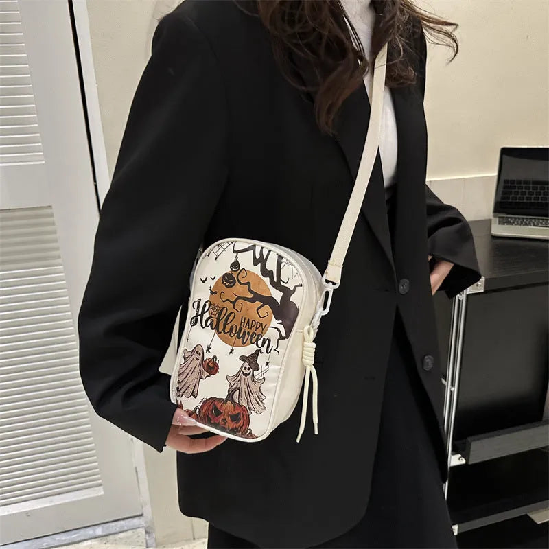 Halloween graffiti crossbody bag with pumpkin ghost bat cartoon prints in medium 14x23x9.5cm size