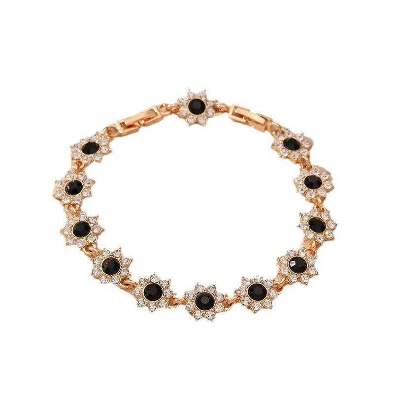 Women's zinc alloy floral bracelet with electroplated finish showing colour variations