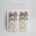 Children's cloth bow hairclips in eight-piece set with dovetail design