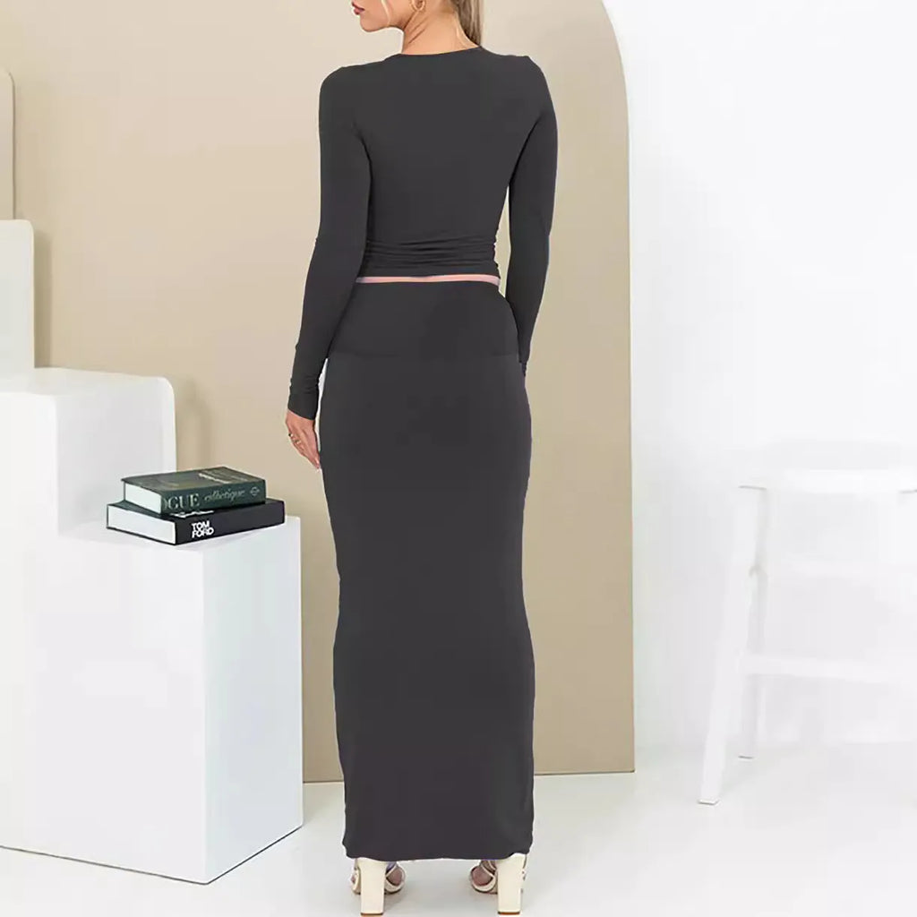 Women's black polyester two-piece autumn suit with sweet style, three-quarter sleeves, and long skirt.