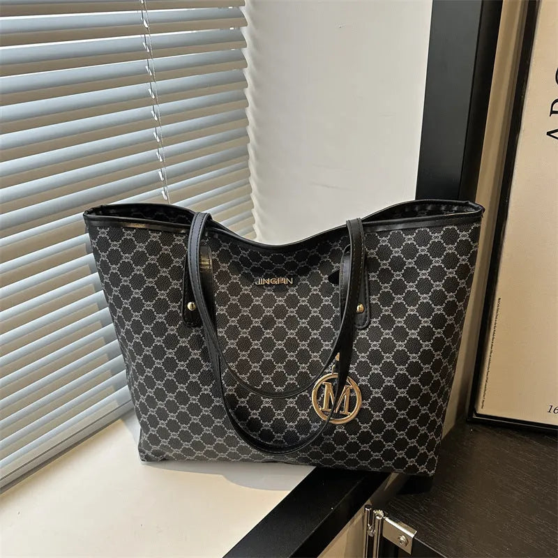 Western style black PU shoulder bag with sewing thread detailing and adjustable strap.
