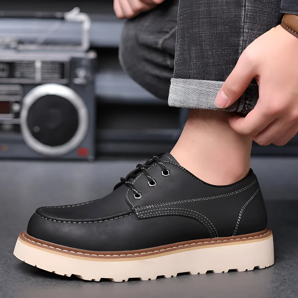 Men's black retro low-top casual boots with a round toe and rubber sole on a white background.