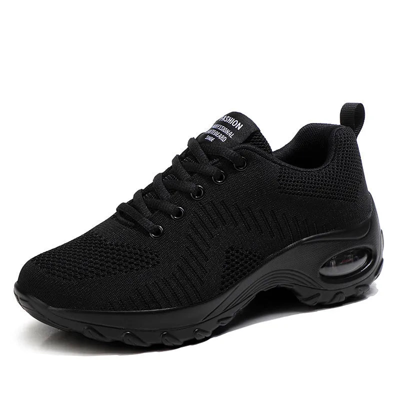 Red women's mesh sneakers with round toe and front lace-up design showing low top silhouette