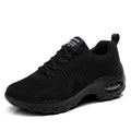 Red women's mesh sneakers with round toe and front lace-up design showing low top silhouette