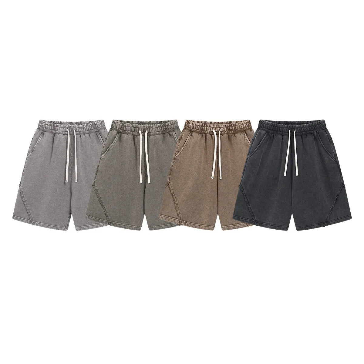 Man's loose-fit cotton terry shorts in a batik wash colour with a craft patch detail, shown in a street fashion style.