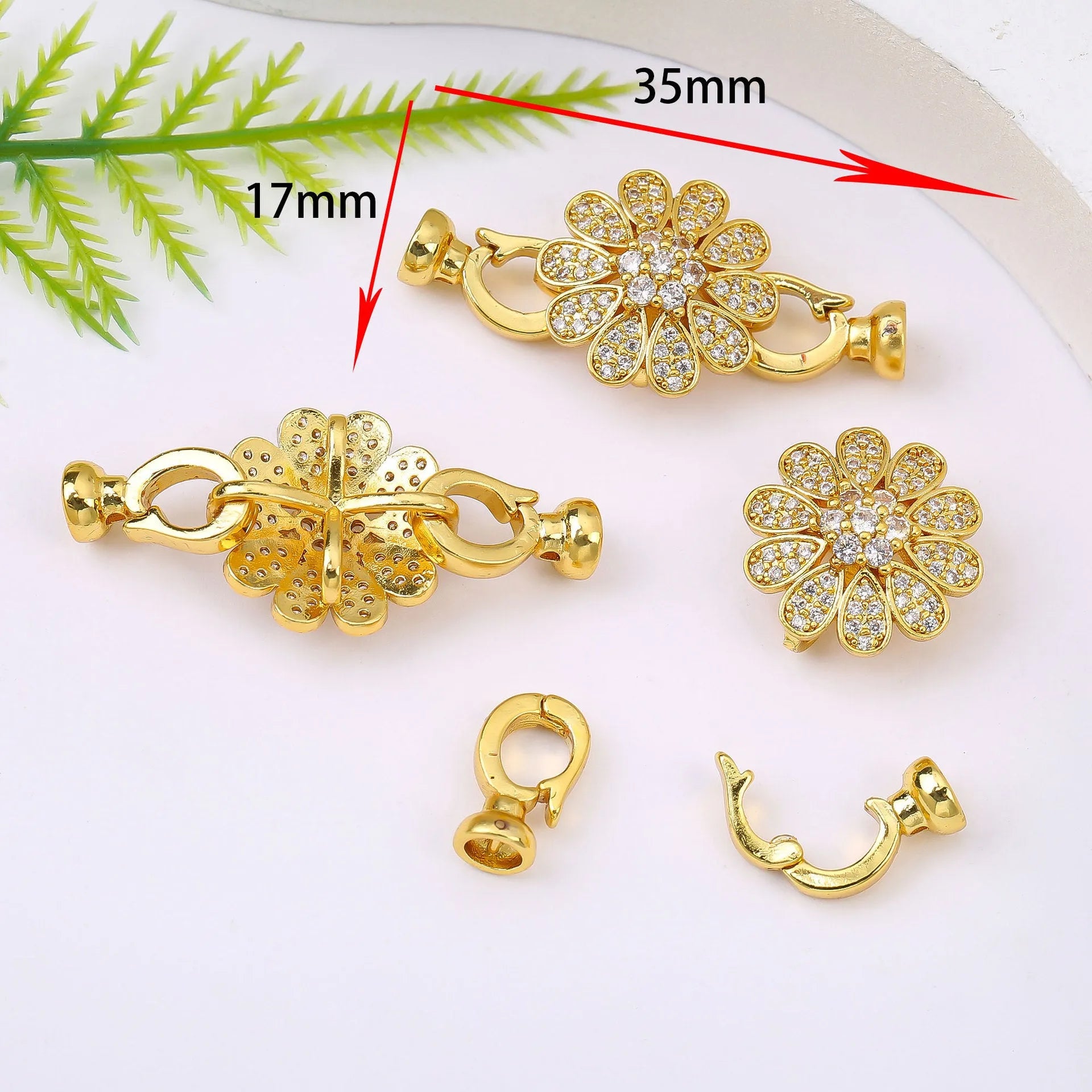 Small gold-coloured jewellery clasp and end hook for DIY necklace or bracelet making and repair.