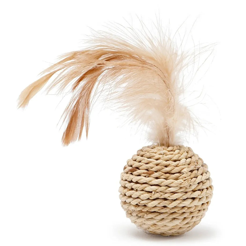 Two cat toys: hollow rattan ball and faux feather ball with bell attachment on neutral background