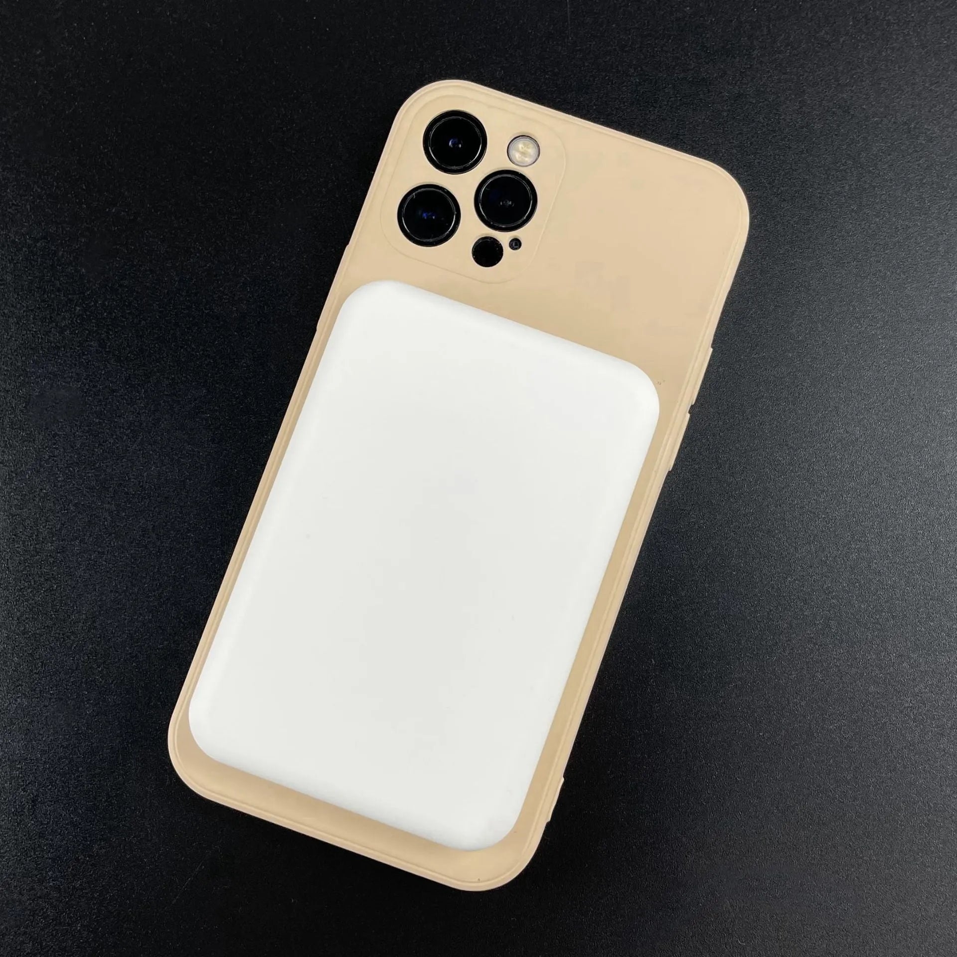 White portable magnetic wireless charger power bank showing compact design and charging surface