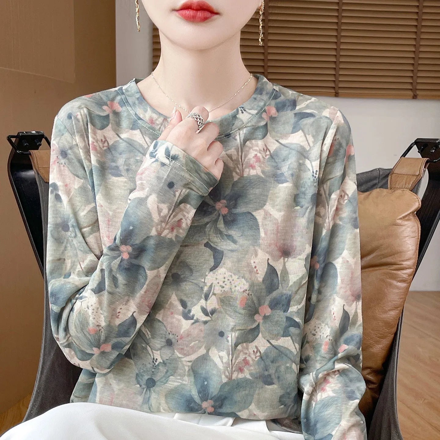 Women's round neck Tencel cotton pullover shirt in a floral print, showing front view.