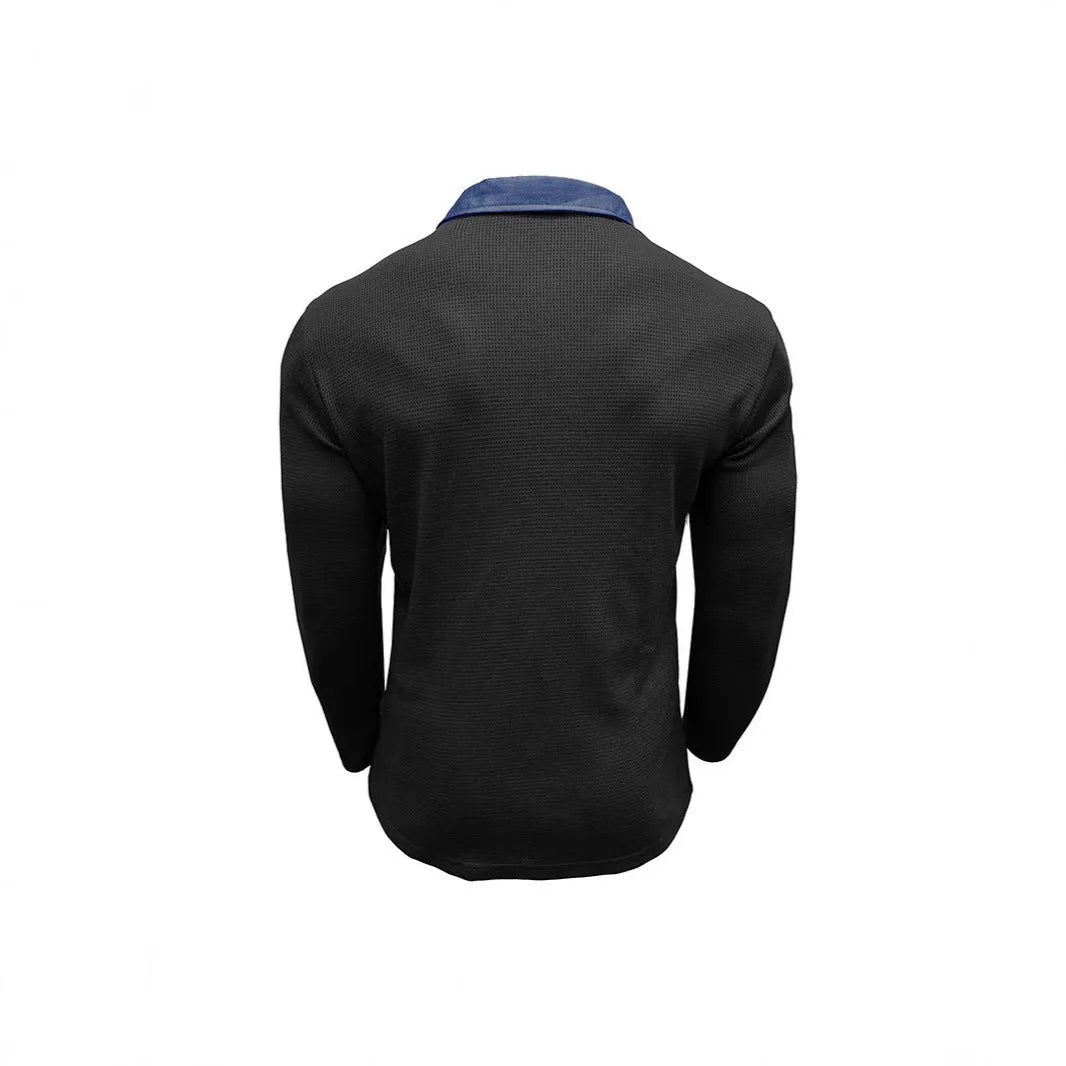 Man wearing a long-sleeved waffle-knit polo shirt in a solid colour with asymmetric detailing.