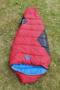 Army green cotton sleeping bag with compression sack for camping, shown with dimensions 230cm by 80cm.