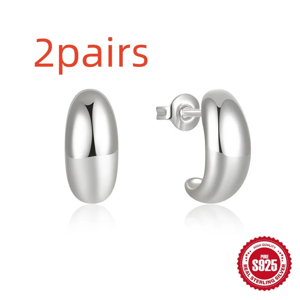 C-shaped geometric earring in sterling silver with gold electroplated finish