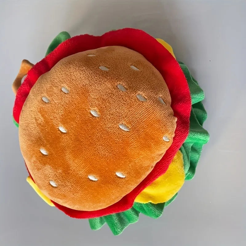 Cat wearing burger headdress collar with lettuce details and elastic chin strap