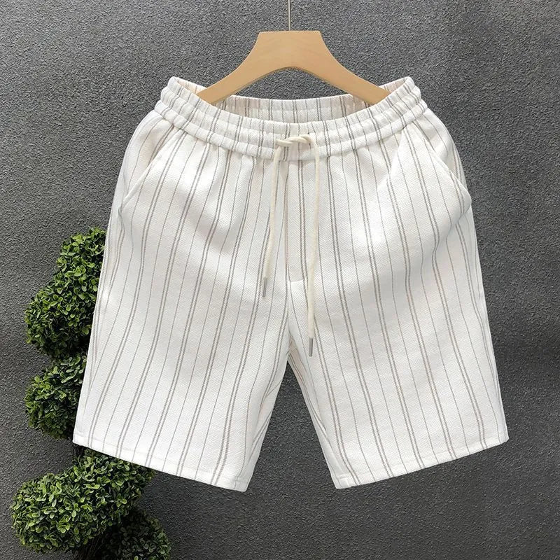 Men's black and white striped fleece-lined shorts with elastic waistband