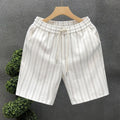 Men's black and white striped fleece-lined shorts with elastic waistband