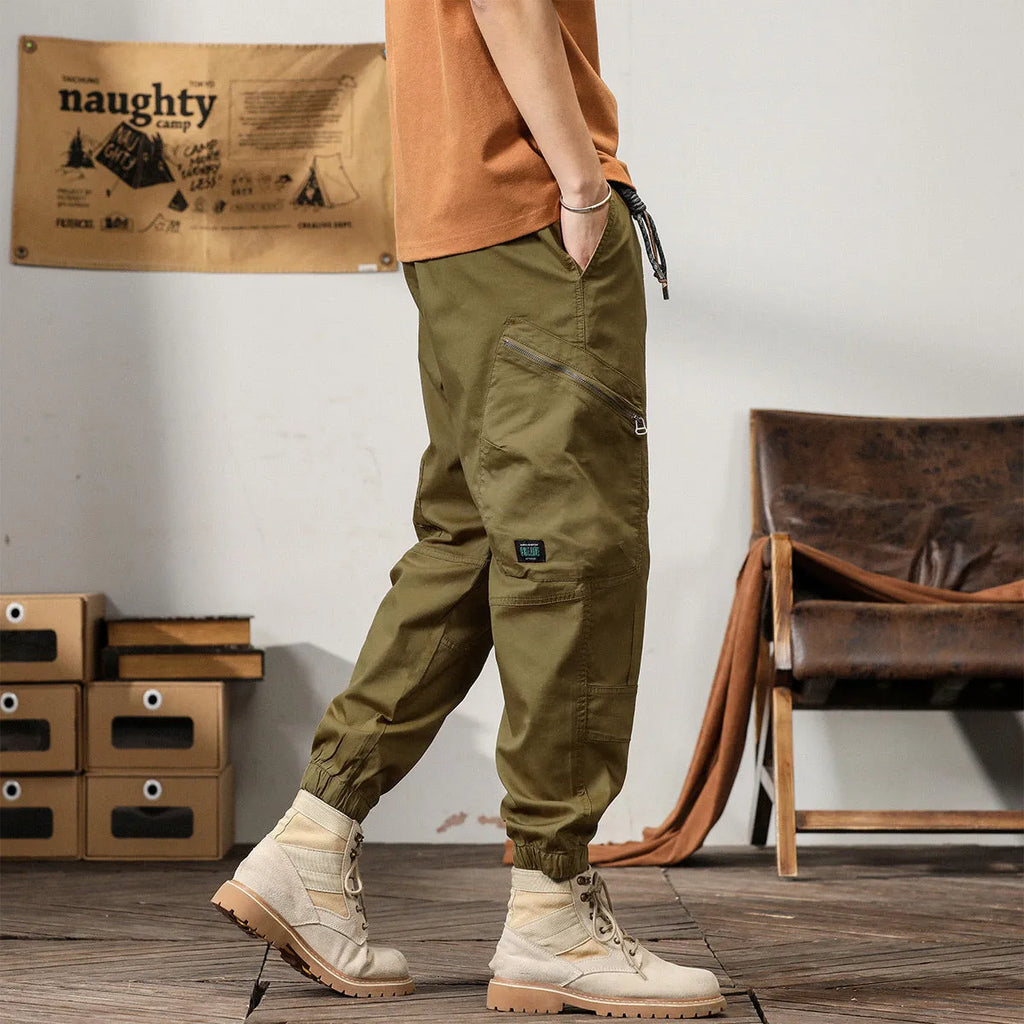 Men's cotton tapered harem pants in black colour with ankle bands and zip fly