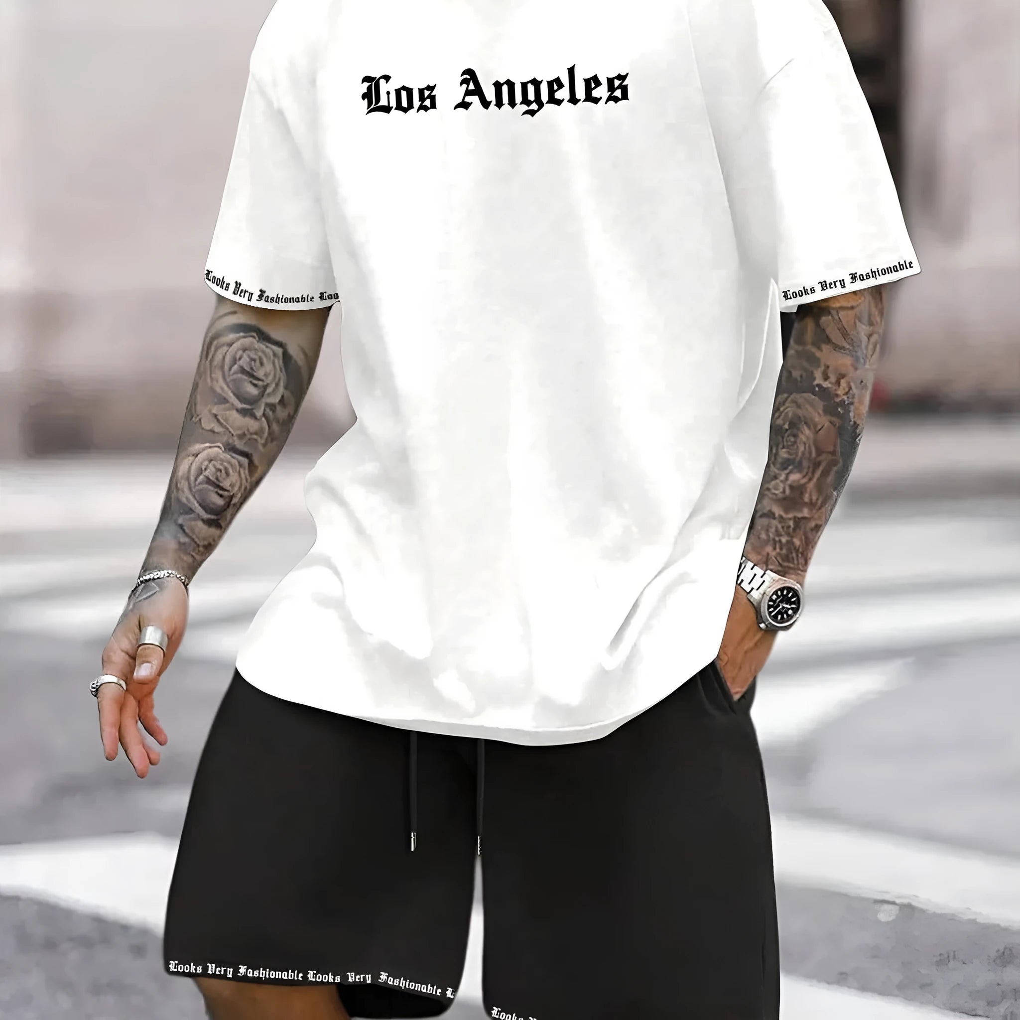 Men's navy blue printed short-sleeved top and matching shorts sports set on a white background