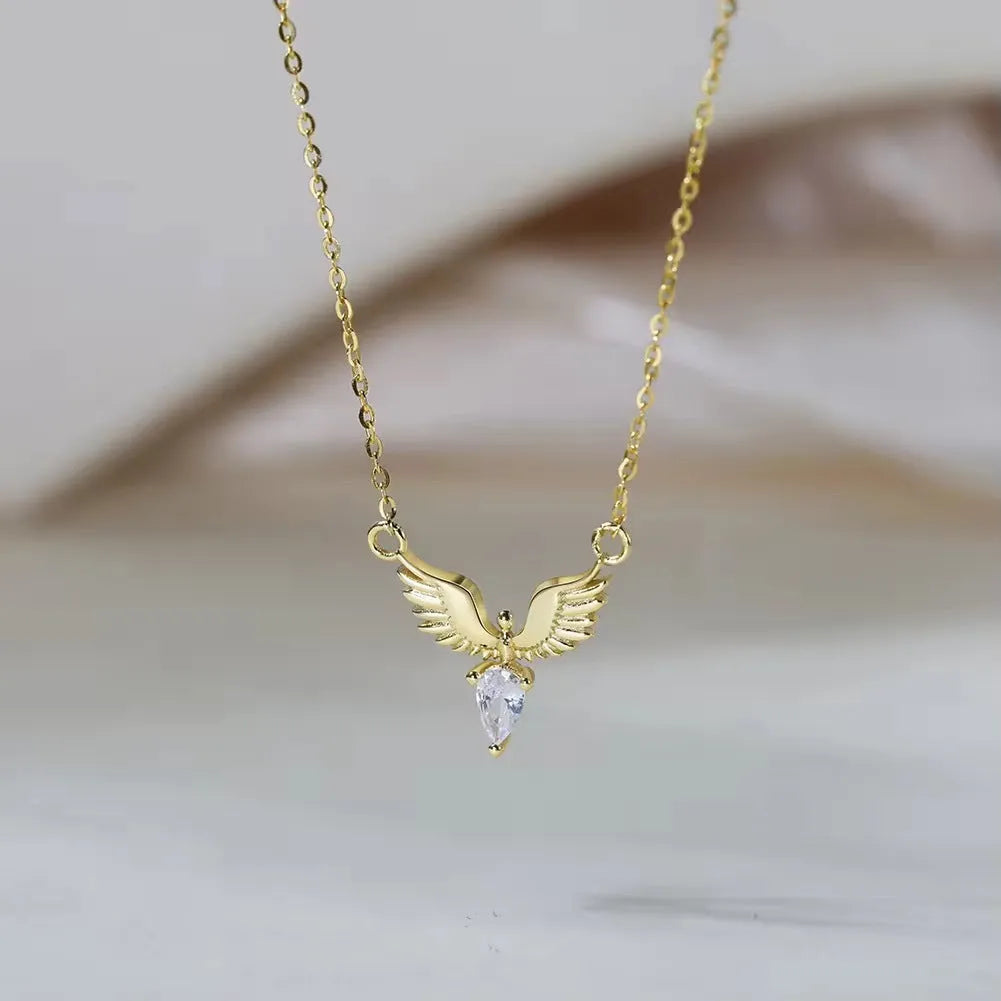 Close-up of a women's sterling silver necklace with an eagle pendant on an O-ring chain.