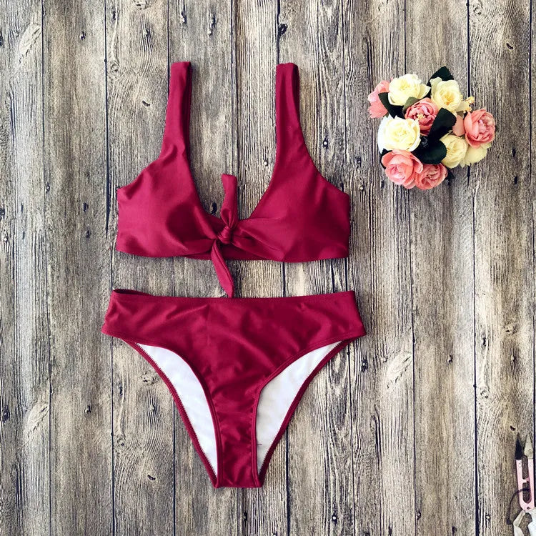 Solid colour polyester bikini swimsuit set on a white background