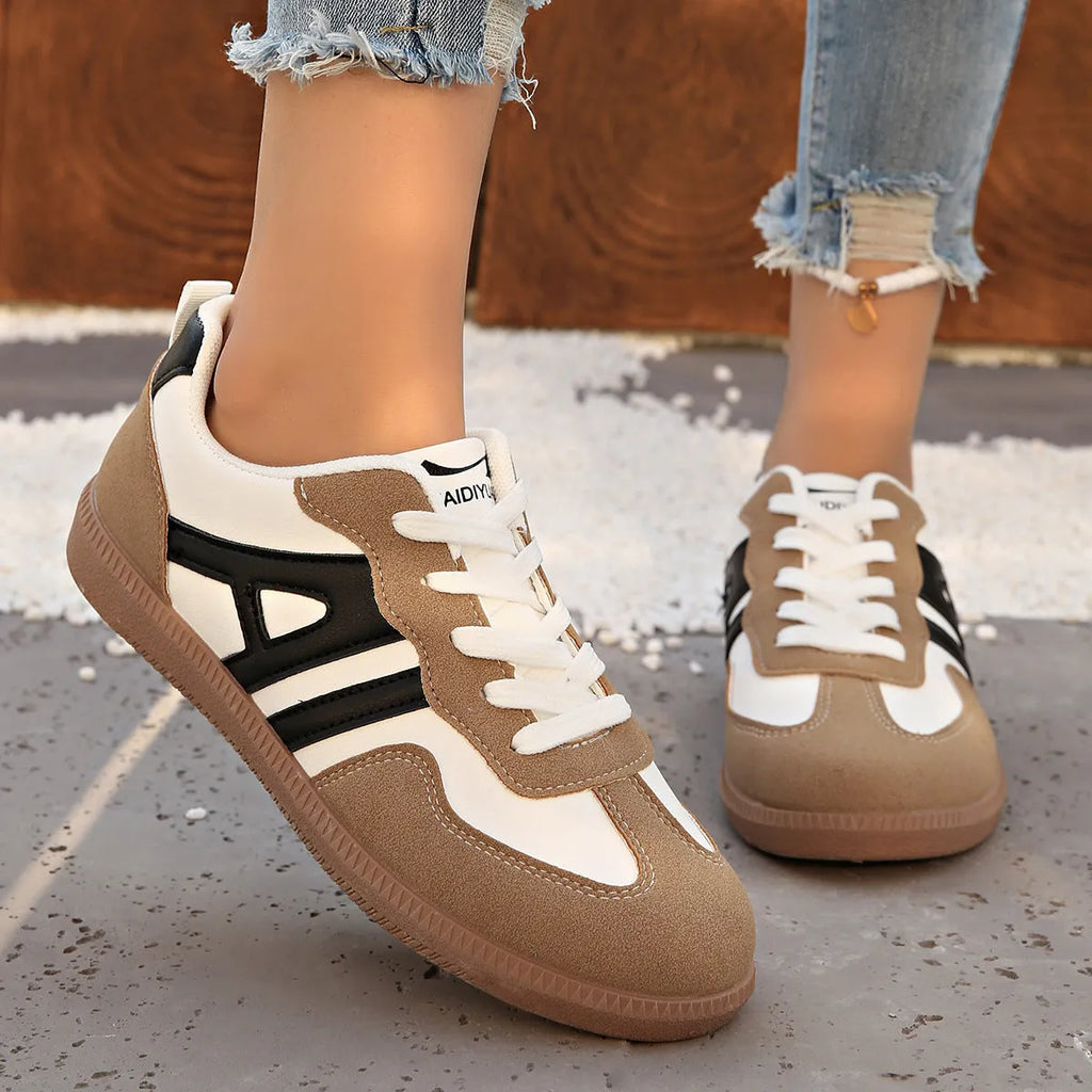 Retro colour-matching lace-up lightweight women's jogging shoes in black, side view showing low top and platform sole