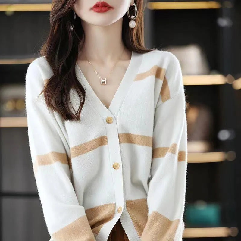 Women's slim-fit V-neck cardigan with 3D striped pattern and button front in assorted colours.