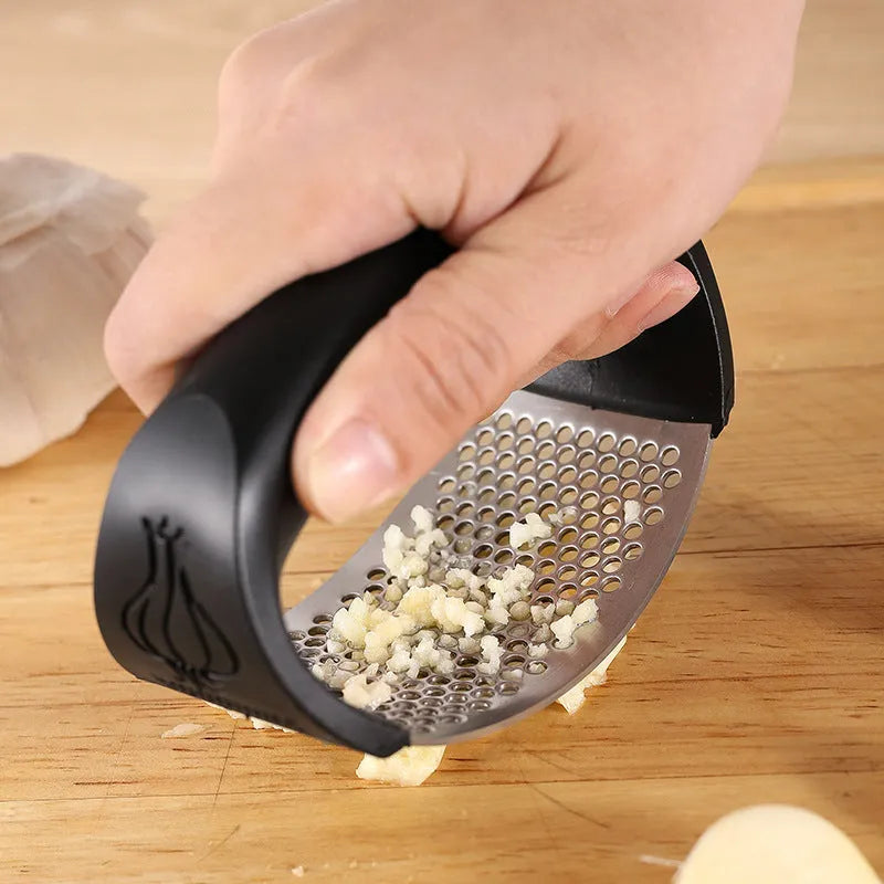 304 stainless steel garlic press 11x7cm in modern simple design on a kitchen counter