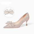 Women's champagne coloured sequined stiletto heel pumps with pointed toe.