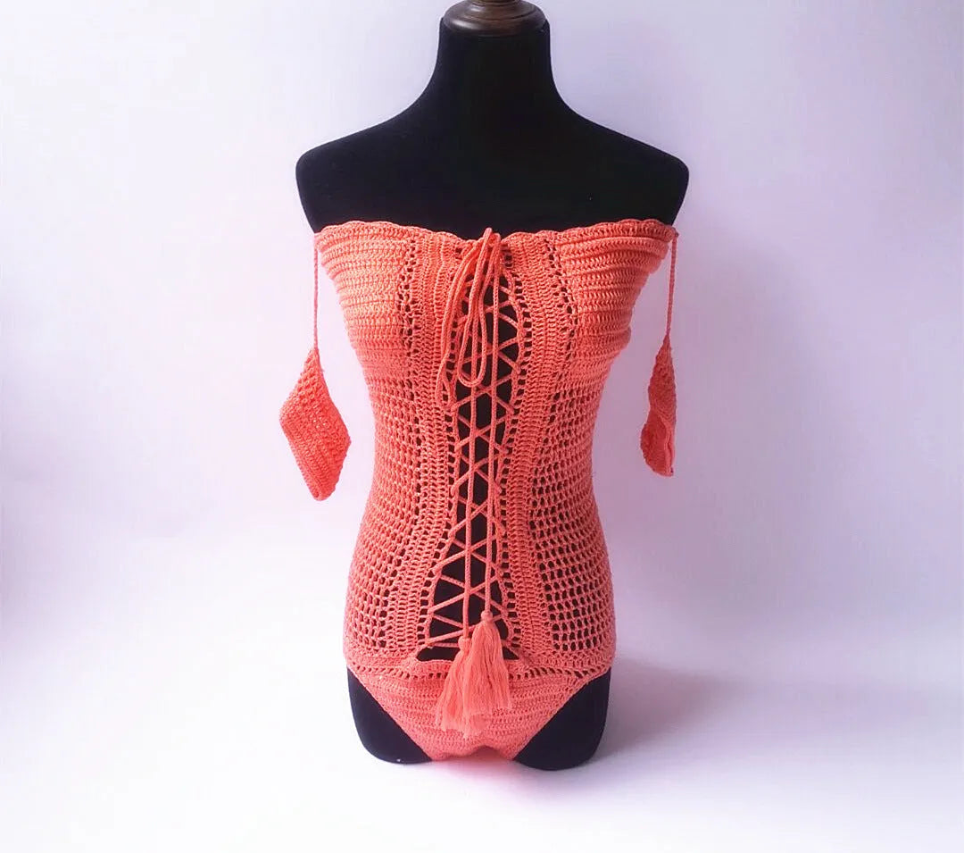 Off-the-shoulder one-piece swimsuit in light pink on a mannequin