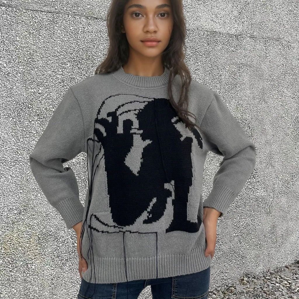 Women's loose alpaca wool tassel sweater in gray, round neck pullover style, side view on model