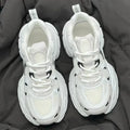 Beige mesh platform sports shoes with wedge heel and front lace-up closure on rubber sole