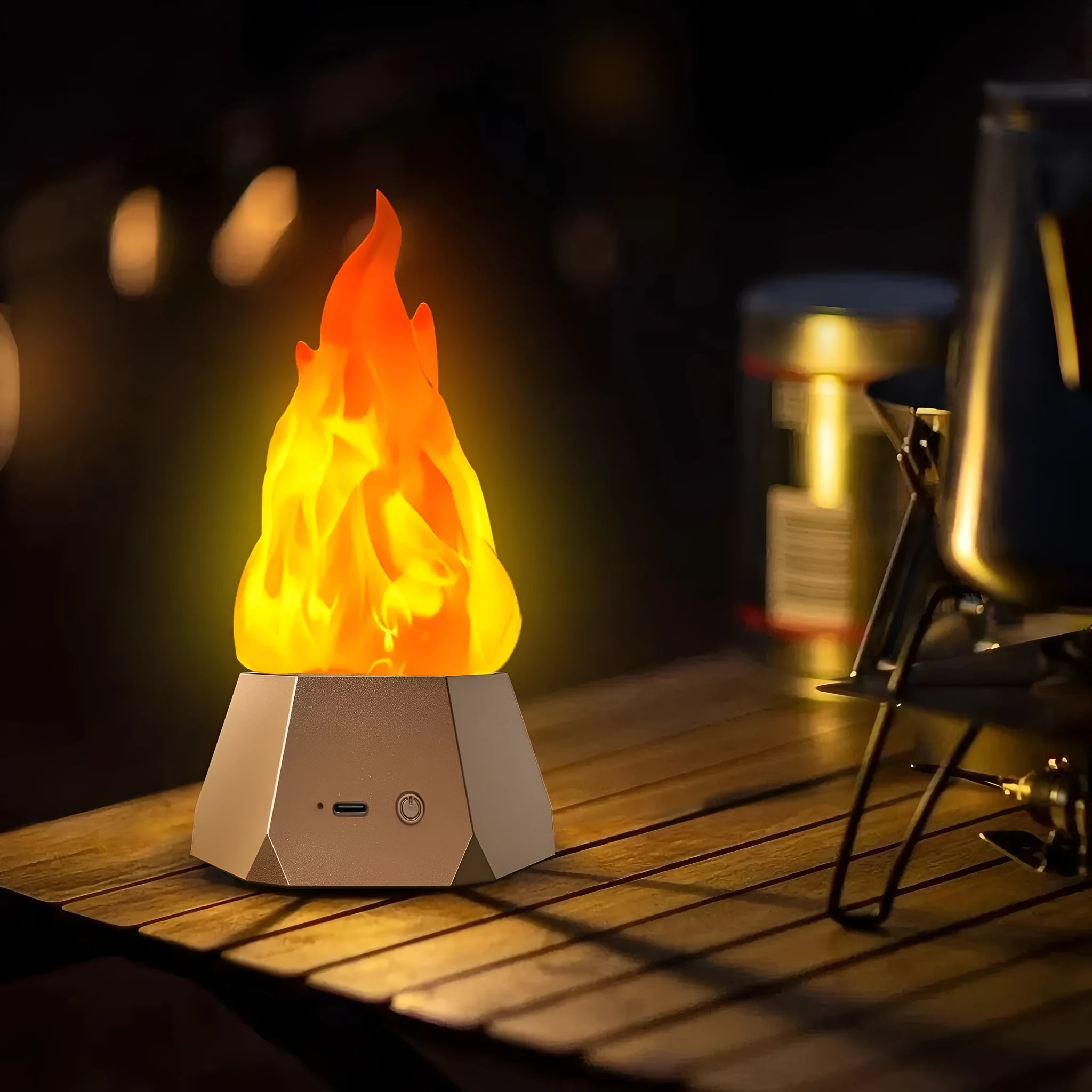 Flame-shaped outdoor decorative light with vinyl shell and gold charging base on a garden table