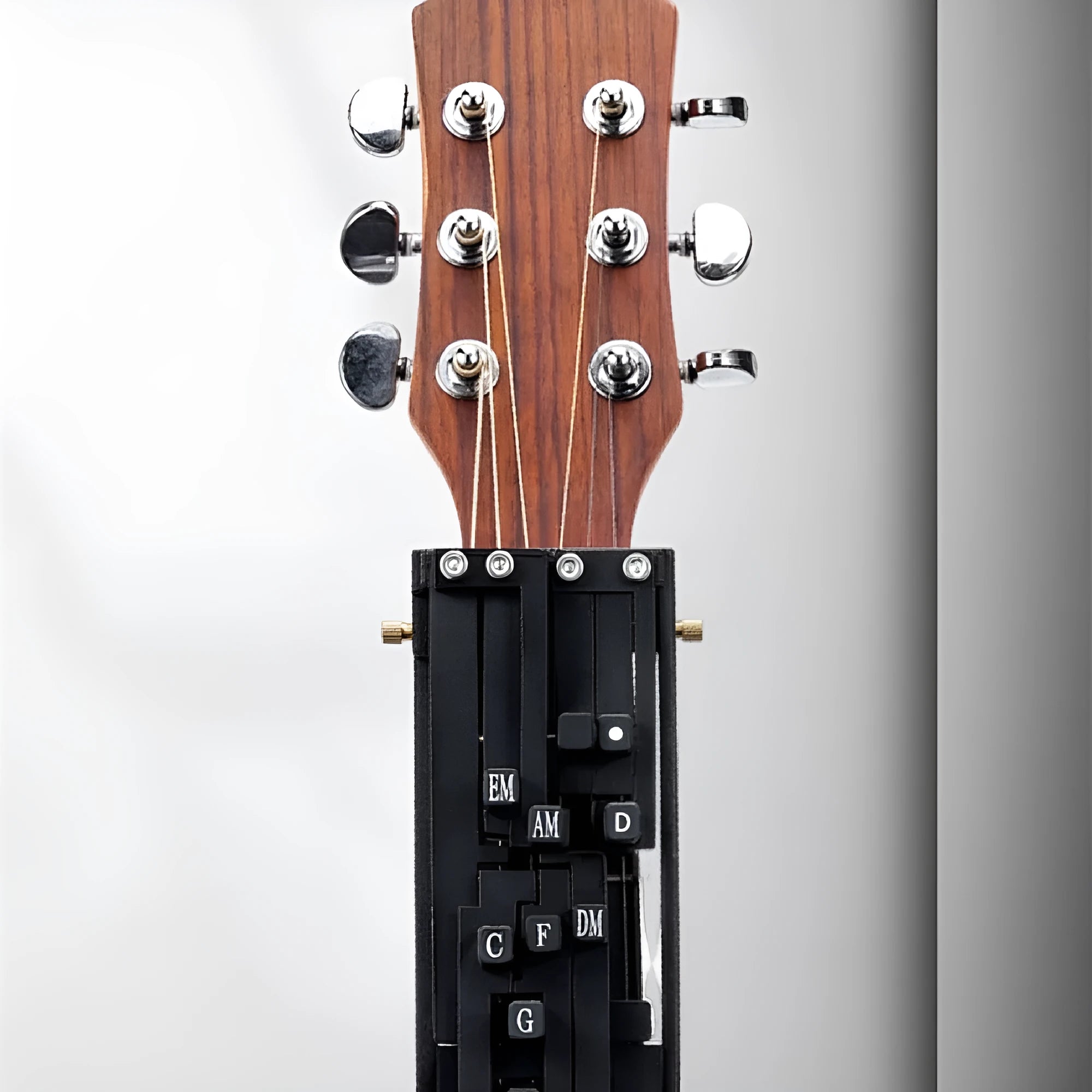 Black automatic guitar chord practice device for novice folk playing and singing