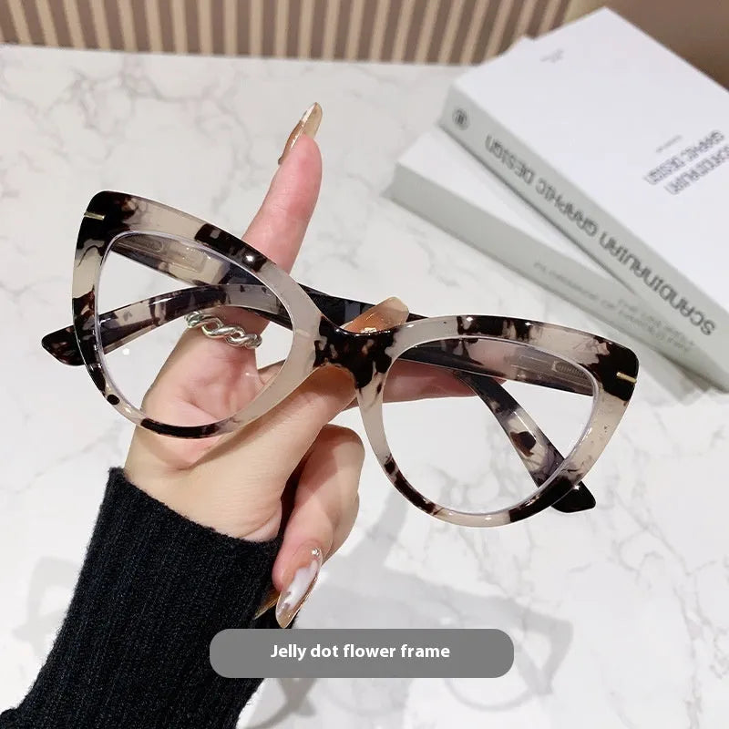 Women's large frame cat's eye reading glasses with dragon and phoenix decorations on the temples.