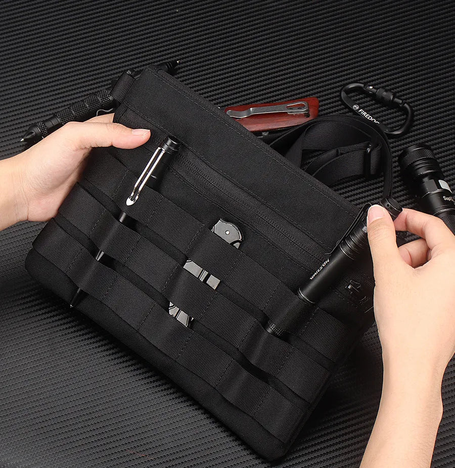 Black oxford cloth outdoor kit bag measuring 18cm by 3.5cm