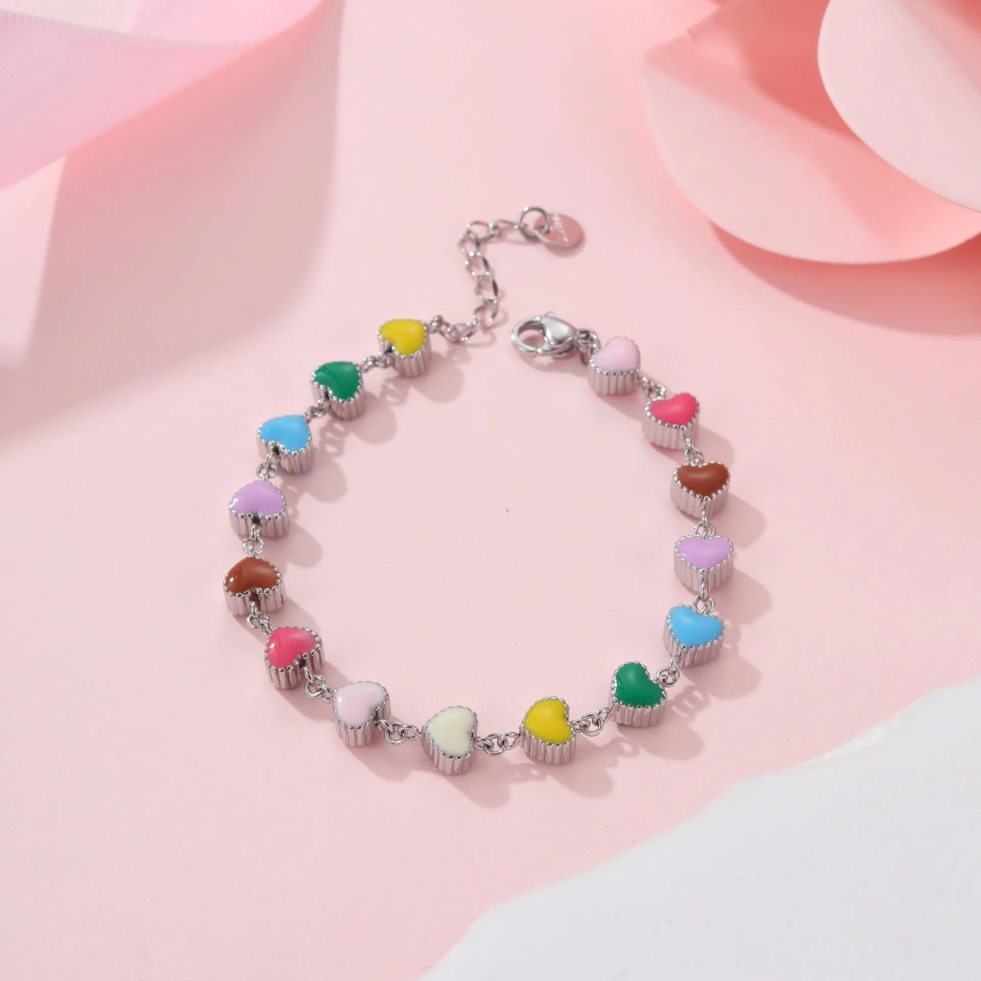Women's titanium steel bracelet with oil-filled heart pendant in gold or steel finish