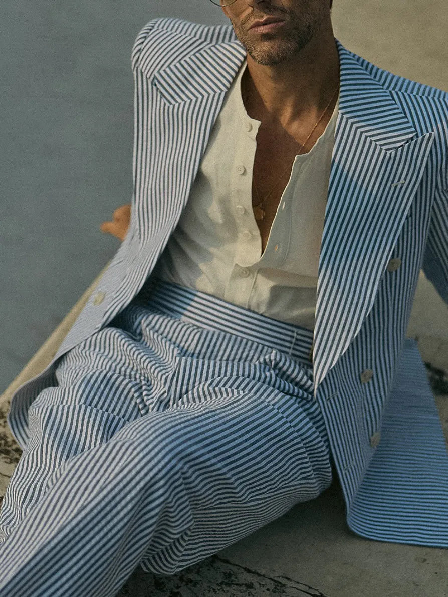 Women's blue and white striped polyester suit set with long-line blazer and matching trousers
