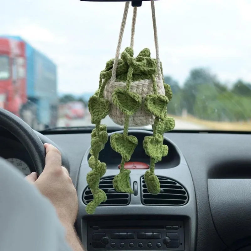 Green and white knitted wool car plant ornament with 25cm hanging rope on 8cm circular base
