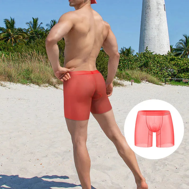 Men's solid colour boxer shorts in orange, pink, or red, made from knitted nylon ice silk fabric.
