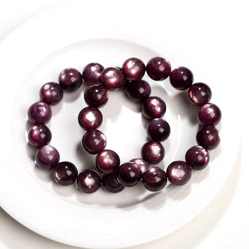 Purple lepidolite crystal bracelet with round polished beads showing multiple size options
