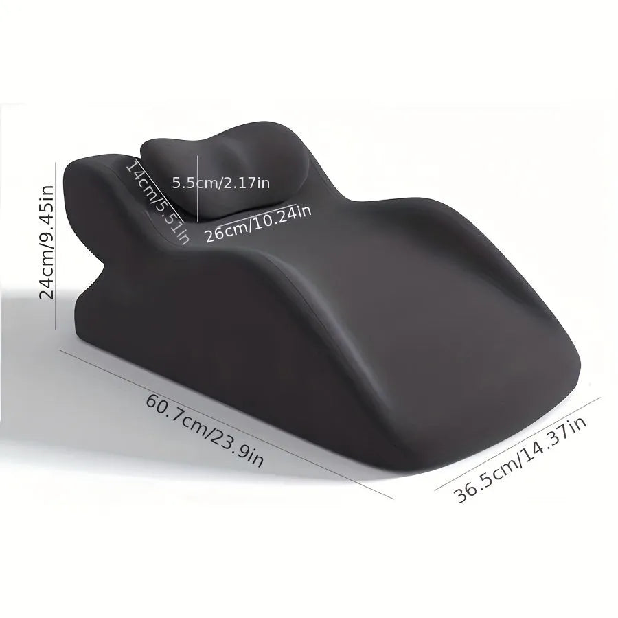 A stomach sleeper pillow shown in light grey, designed for prone positions and reading in bed.